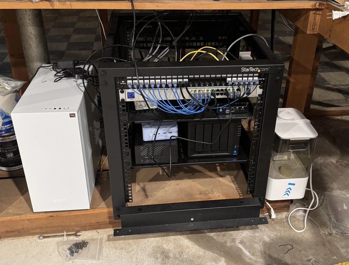 My server rack in my basement containing all my self hosting hardware